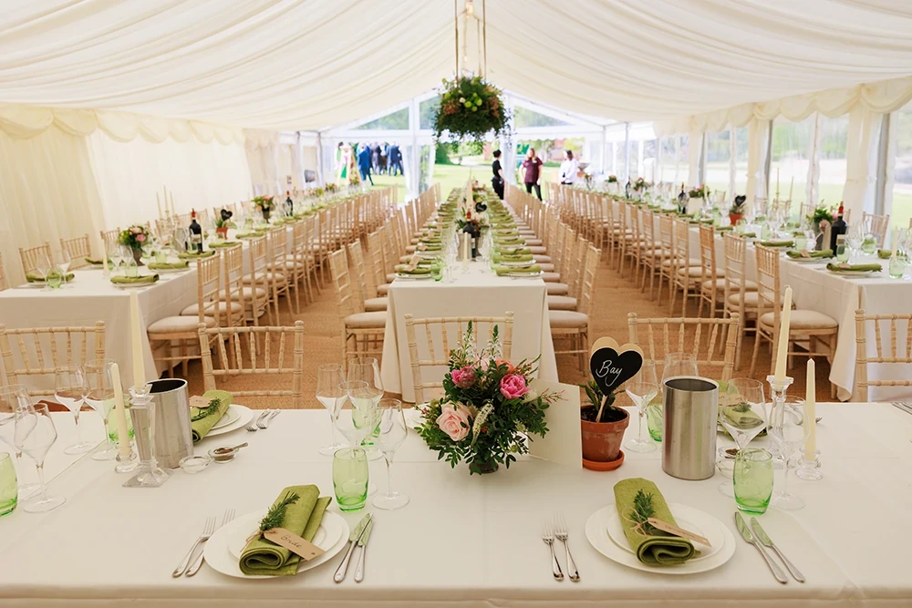 Formal table setting inside an Essex marquee for a wedding or special event